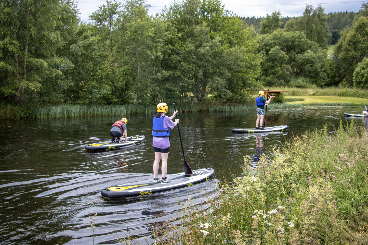 Spotting wildlife while paddle boarding with Cairngorms Activities